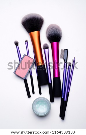 Make-up kit pattern with brushes, face cream and blusher Royalty-Free Stock Photo #1164339133