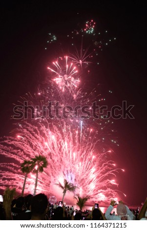 Red fireworks in the sky in celebration of Eid in Dubai