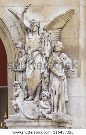 Architectural details of Opera National de Paris: Lyrical Drama Facade sculpture by Perraud. Grand Opera (Garnier Palace) is famous neo-baroque building in Paris, France - UNESCO World Heritage Site.