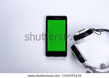 Wireless Headphone and smartphone with Green screen - Chroma Key images