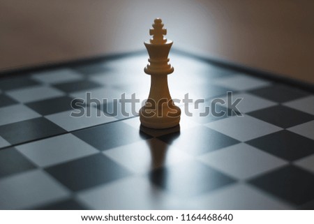 White king of chess board game, soft to focus, ideas for business and leadership concept.