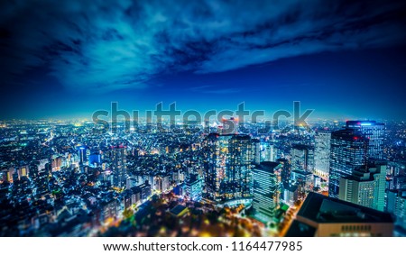 Asia Business concept for real estate and corporate construction - panoramic modern city skyline aerial night view of Shinjuku in Tokyo, Japan. miniature lens tilt shift blur effect 