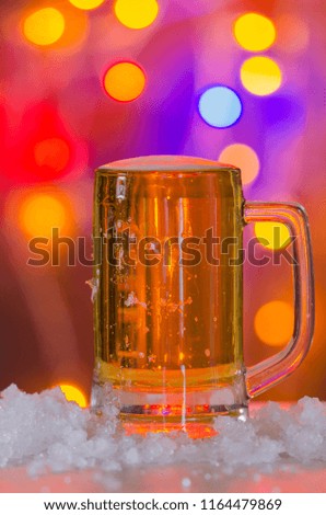 Glass of beer on a table on a pub background.Alcohol Celebrate Refreshment concept.