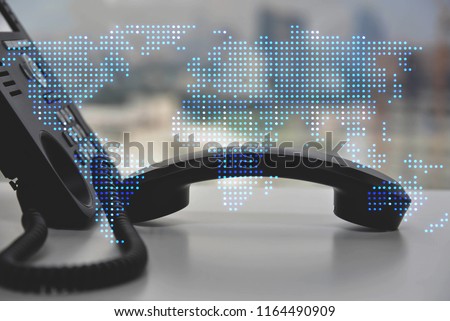 IP Phone double exposure of blue LED world map for communication concept Royalty-Free Stock Photo #1164490909