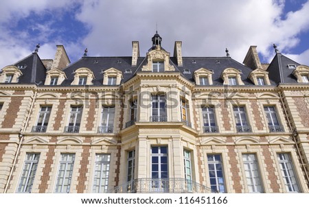 Looking up facade of small castle in Sceaux near Paris, France