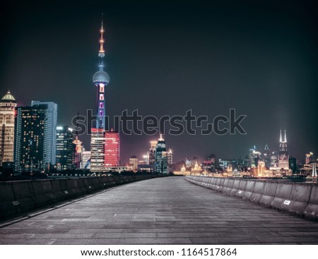 Shanghai, China :Nightscape of Lujiazui skyline as seen from the Bund, across the Huangpu River, with the Shanghai Tower.