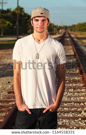 Handsome young man outdoor fashion portrait