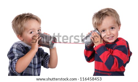 Little boy playing with can phone connected by string, concept for talking to yourself Royalty-Free Stock Photo #116458453