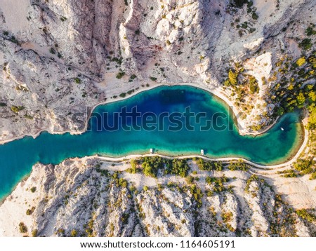 Zavratnica is a 900 m long narrow inlet located at the foot of the mighty Velebit Mountains, in the northern part of the Adriatic Sea. Royalty-Free Stock Photo #1164605191