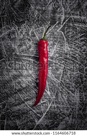 Vintage rustic background with chilli peper. Toned picture