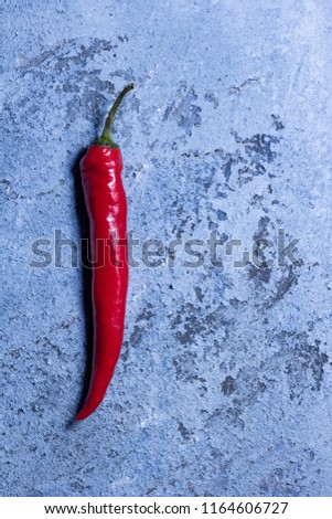Vintage rustic background with chilli peper. Toned picture