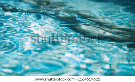 Abstract water image shows unique water movement that can be used for backgrounds or as a picture. This surface ocean image has a unique texture and rich aqua colors.