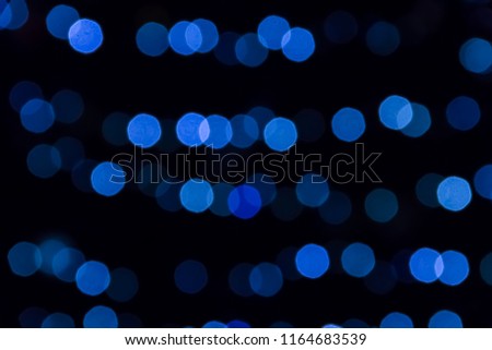 Blurred abstract bokeh background. Blue lights