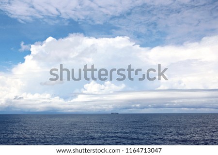 Seascapes. Various kinds of colorful blue sky, sun, clouds and open spaces of the world ocean. View from the side of a sea ship while moving and in the port at anchor.
