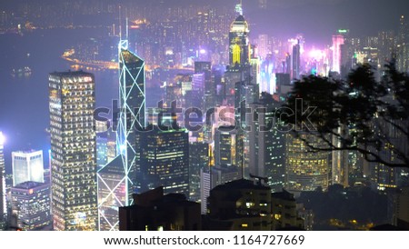 Hong Kong Skyline At Night Seen From Above With Trees And Nature in Frame - Hong Kong - April, 2018