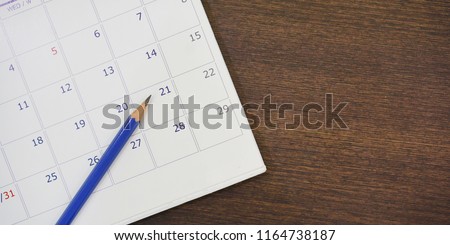 close up soft focus on pencil over calendar 2021 at office desk with top view concept