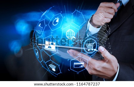 E-commerce concept with VR digital interface with icons of shopping cart and delivery truck and credit card with symbol of online purchase on internet.businessman success working computer touch screen