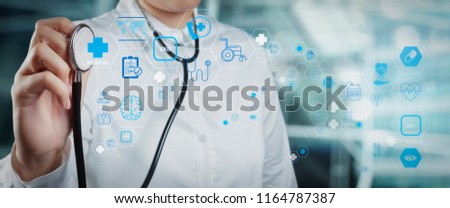 Health care and medical technology services concept with cinematography screen and AR interface.Smart medical doctor working with operating room as concept 