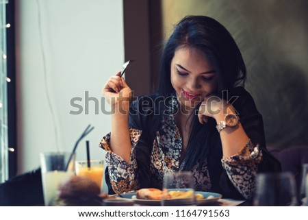 Shy woman on first date with her co-worker being nervous and happy at the same time.