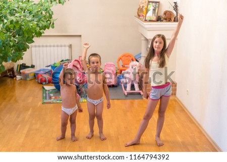 Three little children do exercises. concept of a healthy lifestyle