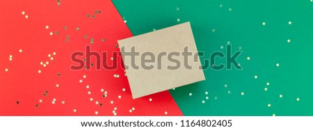 New Year or Christmas presents preparation DIY flat lay top view Xmas holiday celebration handmade gift boxes on red green paper background. Template mockup for greeting card long wide banner 2019