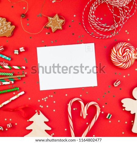 Creative New Year or Christmas greetings letter mockup flat lay top view Xmas holiday celebration envelope on red paper background golden glitter. Square Template mock up greeting card text 2019 2020