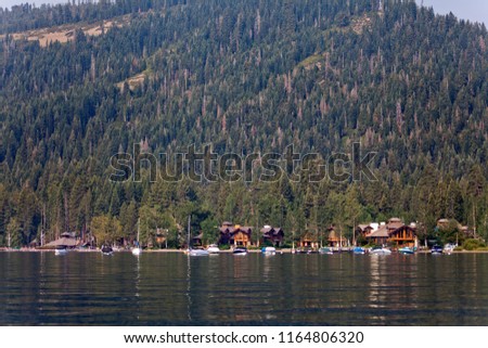 Lake Tahoe view from the lake onto mountains and forests in California