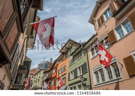 Switzerland flag on streets of old Zurich