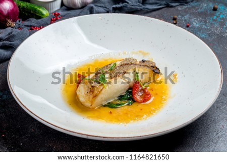 halibut steak on plate