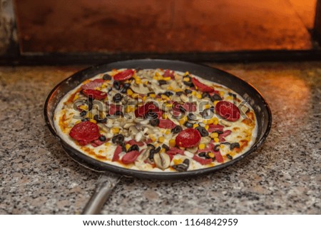 Cooking of pizza in the oven
