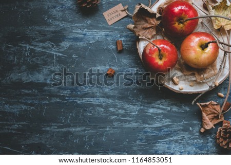 Autumn background with copy space. Delicious autumn caramel apples with autumn decoration, top view. Hello autumn