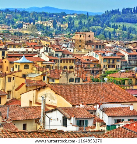 Aerial view. Many yellow buildings with red tile roofs in the old city. Panoramic skyline. Italian urban landscape. Italy, Tuscane, Florence 