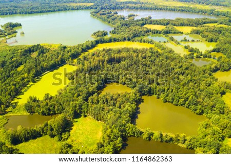Aerial view of summer countryside with many lakes for common carp breeding in South Bohemia. Famous tourist landscape from above. South Bohemia in Czech republic, European union.