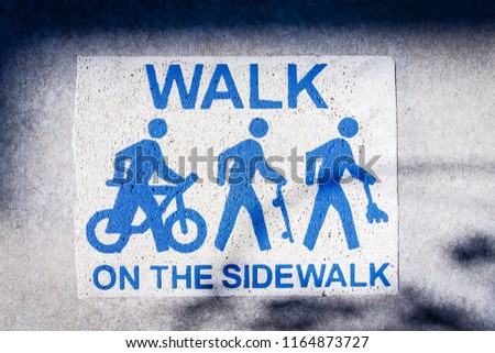 Walk only on sidewalk sign