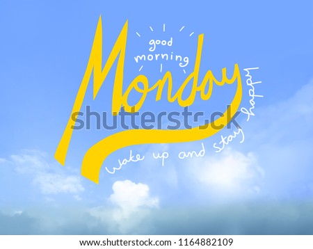 Good morning monday wake up and stay happy word handwriting on blue sky background