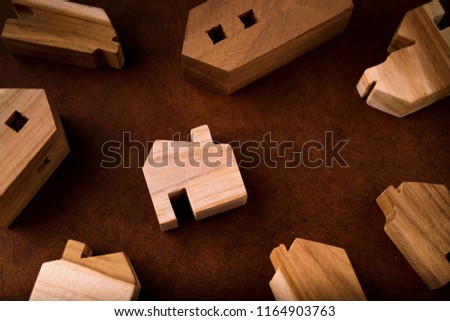 business asset mortgage ideas concept with wooden home model many size with free copy space for your creativity ideas texts
