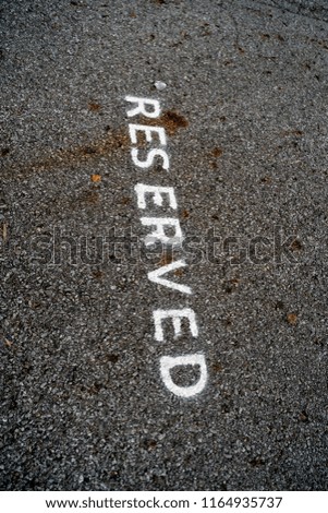 Reserved Text on Parking Spot