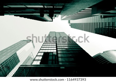 Bottom up view of Modern office building in green color