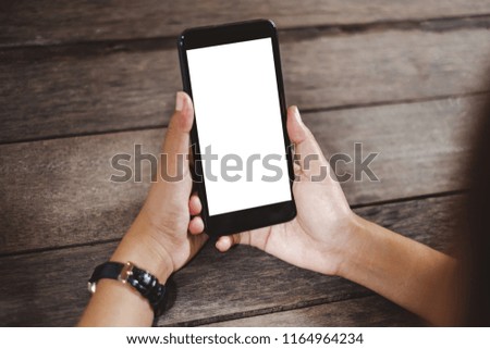 Hands holding / using smartphone / cell phone with isolate screen for internet online shopping and e-commerce transfer money concept