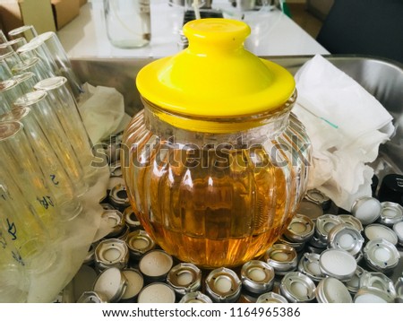 Glass bottle with lid Used to dispose of transformer oil that has been tested.