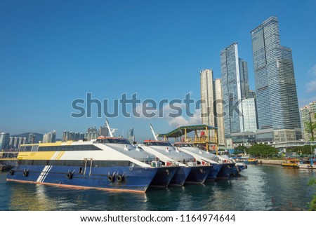 Passenger ship and pier in Victoria habor in Hong Kong city