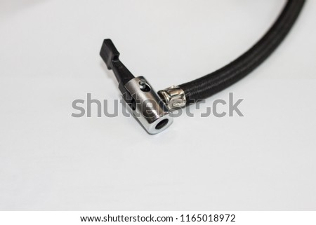 Detail of black bicycle air pump isolated over white background
