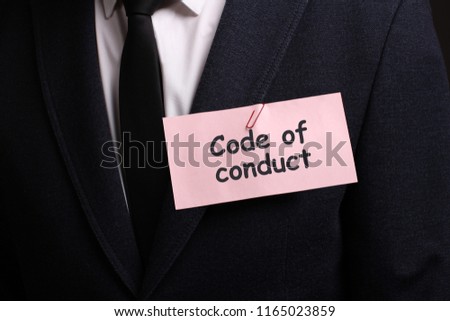 The concept of business, technology, the Internet and the network. A young entrepreneur working on a virtual screen of the future and sees the inscription: Code of conduct 
