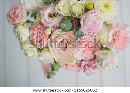 Beautifil bouquet of flowers with roses, eustomas, eucalyptus. 