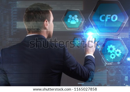 Business, Technology, Internet and network concept. Young businessman working on a virtual screen of the future and sees the inscription: CFO