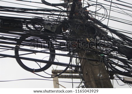 Many cable on single pole. It's in Thailand.