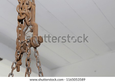 Rusty steel chain Wrapped on a steel hook.
