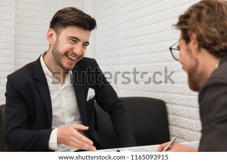 Two businessmen are negotiating a trade agreement together. Business and meeting concept. Job and occupation interview theme.
