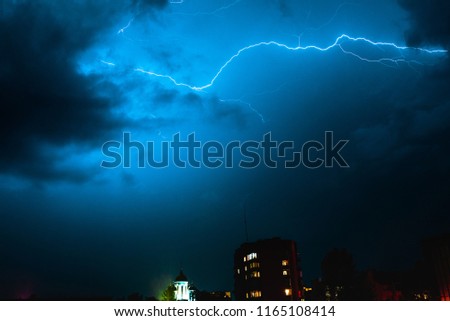 Nature force background - bright lightning in dark stormy sky