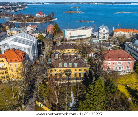 Aerial drone view of beautiful city Helsinki at Autumn with sea ,Blue sky, clouds and colorful buildings. Helsinki, Finland.